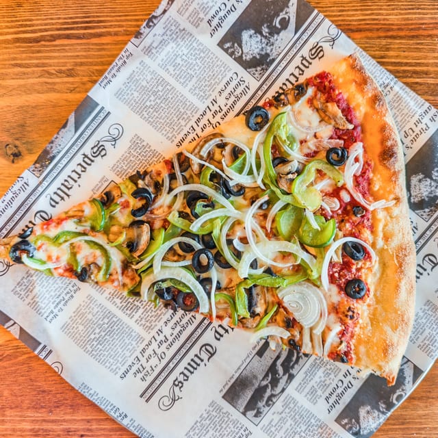 Veggie Supreme Pizza Slice.